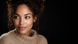 © Micevic family - Portrait of a beautiful woman with curly hair looking away on black background