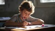 © MdSaifullaharman - Focused elementary school student diligently working on his assignment in a sunlit classroom