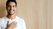 © Yuliia - Happy Young Man with Warm Smile and Hand on Heart, Genuine Gratitude and Positive Expression Portrait