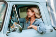 © Natalie Wheeler - Woman driving vintage truck
