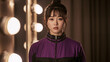 © bephoto - 楽屋で紫黒のジャージを着る日本人女性ダンサー