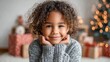 © MiraeStudio - Joyful young girl with curly hair smiling warmly in a cozy, festive holiday setting