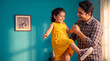 © Niks Ads - happy indian father and daughter enjoying together at home