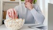 © Svetlana - Man watches a movie on a laptop