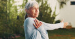 © peopleimages.com - Backyard, wellness and senior woman stretching for functional fitness, shoulder mobility or exercise. Active, pensioner or arm warm up at house for retirement health, physical activity or flexibility