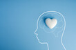 © tete_escape - Mental health concept. Human head outline with heart inside brain. Emotional wellbeing, self care, psychological support, emotional intelligence, mindfulness, compassion, and holistic mental wellness.