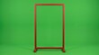 © asqi - Red rectangular metal frame standing on green background