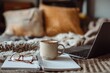 © matucha12 - Organized home workspace featuring a laptop, coffee mug, and reading glasses emphasizing productive remote work environment, focused daily routine, and comfortable work from home setup