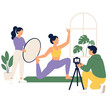 © Rahmansyah - Professional yoga instructor filming a fitness tutorial video with a camera crew.