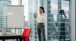 © Vision Vault - Businesswoman on Phone Call Gesturing Peace Sign While Standing by Whiteboard in Modern