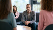 © Gold - Male therapist listening compassionately to a client during a counseling session, women speaking with reporter, business women, women sitting with reporters, a woman is presenting