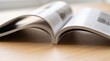 © Photos for you  - Open magazine on wooden surface, pages spread