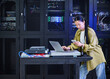 © Erik Isakson - Asian Female Cybersecurity Professional Working in Data Center