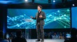 © Azorahaiá - Confident male speaker presenting on stage with digital network background at a conference event