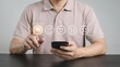 © Amena - A man in a light pink shirt giving a positive rating on his smartphone with emoticon icons