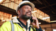 © peopleimages.com - Construction, phone call and happy black man in workshop for material delivery, feedback or planning. Mobile, engineer and mature person with update, building development or architecture industry