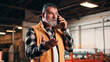 © peopleimages.com - Carpentry, conflict and phone call with man in warehouse for management or problem solving. Feedback, manufacturing and production with mature person in woodworking factory for mobile disagreement