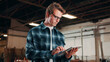 © peopleimages.com - Carpentry, industry and tablet with man in warehouse for management, planning or research. App, manufacturing agenda and production schedule with person in woodworking factory for furniture business