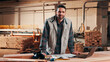 © peopleimages.com - Carpentry, portrait and man by laptop in workshop for planning, schedule or manufacturing quote. Warehouse, happy person or carpenter with tech for woodwork or furniture production with smile