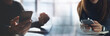 © tippapatt - Business and technology background. Business people using smartphone and laptop working together in modern office. social media networking, online communication, business collaboration