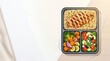 © Dido - Grilled chicken with quinoa and vegetables in meal prep container