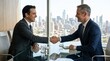 © Faisal - Two smiling businessmen shaking hands to seal a deal in a modern office with a