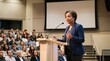 © Pris - Confident Woman Speaker Addresses Audience in Auditorium Presentation