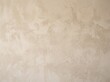 © Dionisia - Soft Beige Plaster Wall Texture Background with Smooth Matte Surface