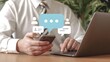 © Soyaeb - Business person engaging in virtual conversations, utilizing mobile and laptop for client communication and online networking in a modern digital environment