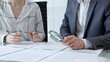© rogerphoto - Business professionals reviewing legal contracts and important documents with a magnifying glass, performing careful examination and due diligence for risk assessment