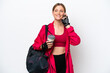 © luismolinero - Young caucasian sport woman isolated on white background holding coffee to take away and a mobile