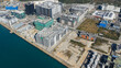 © AmazingAerialAgency - Hong Kong, Hong Kong - 14 February 2026: Aerial view of the Tseung Kwan O industrial estate with modern data centers, warehouses, and construction sites along the waterfront.