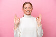 © luismolinero - Young caucasian woman isolated on pink background in zen pose