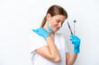 © luismolinero - Dentist caucasian woman holding tools isolated on white background suffering from pain in shoulder for having made an effort