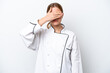 © luismolinero - Young chef woman isolated on white background covering eyes by hands. Do not want to see something