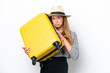 © luismolinero - Young caucasian woman isolated on white background in vacation with travel suitcase and unhappy