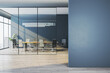 © Who is Danny - Modern corporate meeting room behind glass walls with empty blue wall foreground as clean mockup space for design templates. 3D Rendering