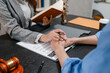 © PHOTO4U - Professional legal consultation between a lawyer and client discussing contracts, legal rights, case strategy, and document review in modern law office, representing justice, trust, and legal services