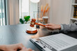 © PHOTO4U - Professional legal consultation between a lawyer and client discussing contracts, legal rights, case strategy, and document review in modern law office, representing justice, trust, and legal services