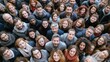 © Chandara - A diverse group of people standing together in a crowd, with a mix of men and women of different ages and ethnicities, all facing forward and smiling, creating a vibrant and inclusive atmosphere.