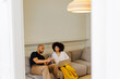 © BONNINSTUDIO/Stocksy - Partners sharing digital content on a mobile device and laptop