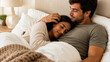 © ArtFocus Studio - Young romantic couple cuddling and resting in bed at home, intimate moment with woman leaning on man's chest