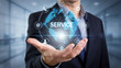 © Omar - Businessman holding virtual globe with service text and communication icons