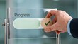 © Ansar - Business hand updating progress status with completed verification on glass interface