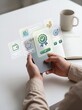 © Mudassar - Person using mobile phone financial application with digital icons and verified status for personal banking