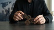 © MDSaijuddin - Businessman holding wooden blocks with BPC acronym for business process
