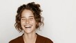 © Viktoriia - Joyful woman laughing with eyes closed in casual attire on white background