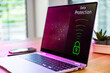 © BusinessClass by W61 - A laptop displays data protection on a wooden desk indoors