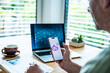 © BusinessClass by W61 - Man uses AI chatbot on mobile device at office desk