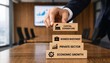 © Rayhan - Businessman building blocks with capital expenditure business investment private sector economic growth concepts on a wooden table in a conference room